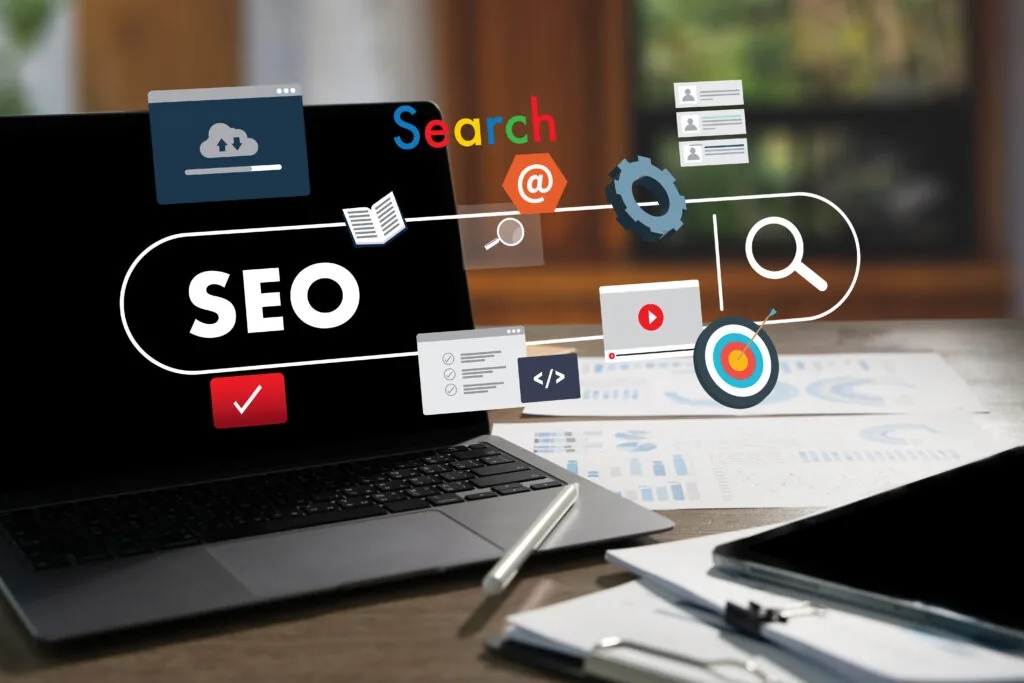 Laptop on a desk surrounded by search and ranking elements