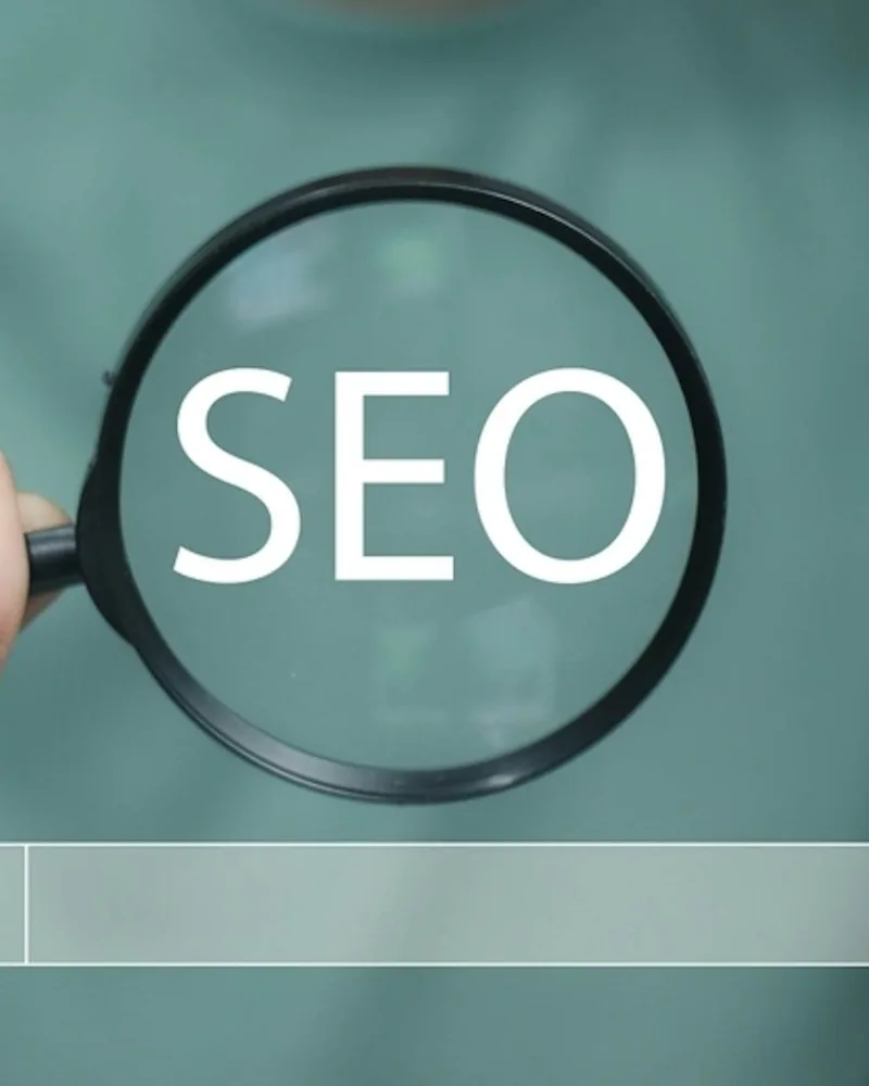 Magnifying glass over the word SEO above a search bar